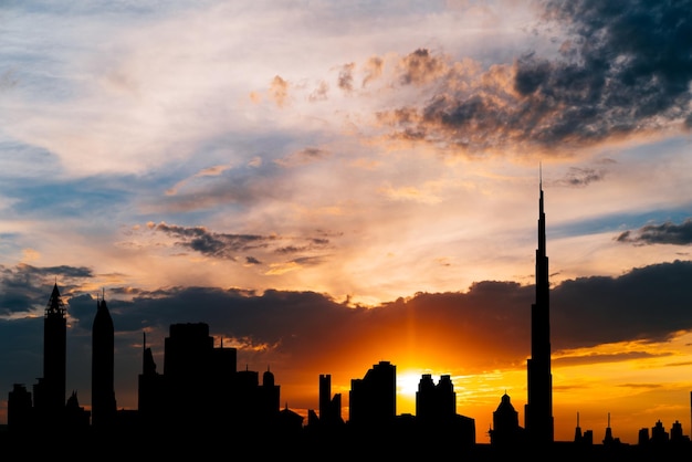 Dubai cityscape silhouette on sunset