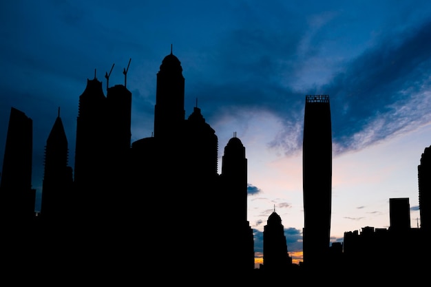 Dubai marina cityscape silhouette on sunset