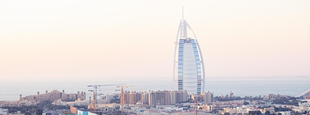 DUBAI UAE JANUARY 24 2022 Panoramic view of seaside skyline during sunset