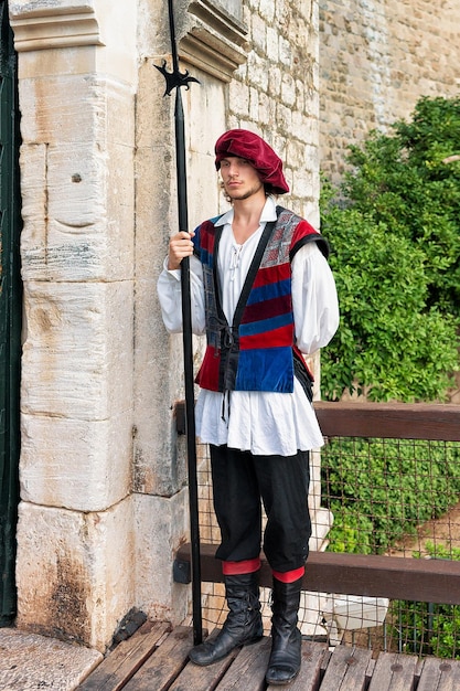 Dubrovnik, Croatia - August 18, 2016:  Guard in traditional costume at the entrance gate in the Old city of Dubrovnik, Croatia