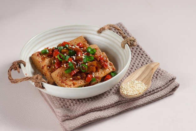 Dubu Jorim is a Korean Braised Tofu. Fried Tofu with Soy Sauce and chillies.