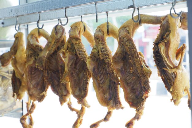 Duck meat that has been boiled or roasted is hung by street vendors