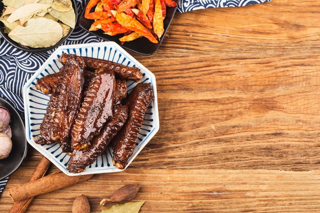 The duck's wings were boiled and placed on a  plate