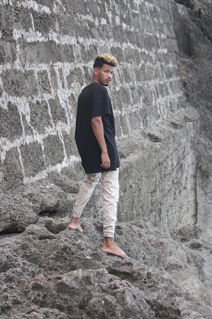 Dude on vacation standing on beach