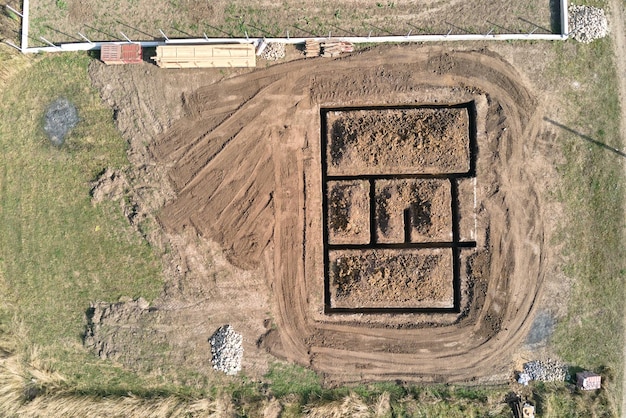 Dug out trench for building works of new house concrete foundation on construction site