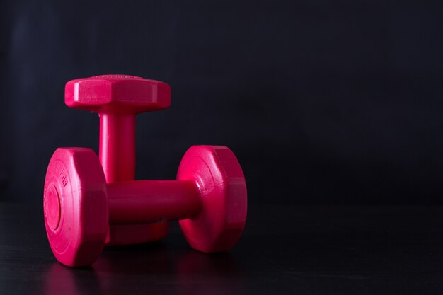 Premium Photo  Dumbbell on a black background