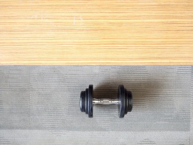 Photo dumbbell on the floor in the gym. healthy and fit concept.