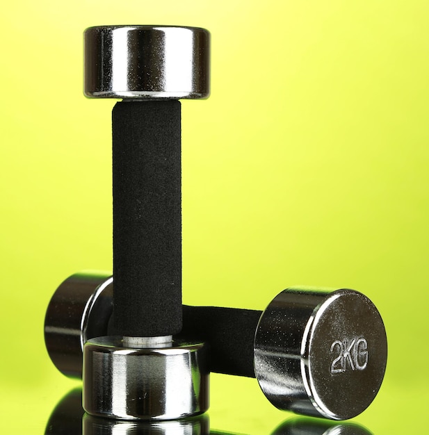 Photo dumbbells at 2 kg on green background