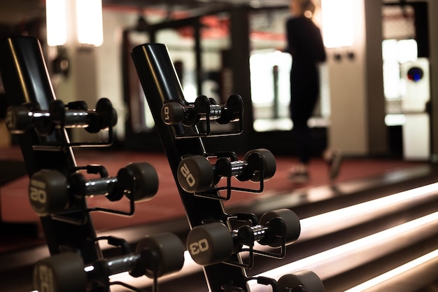 Dumbbells in the fitness club gym concept