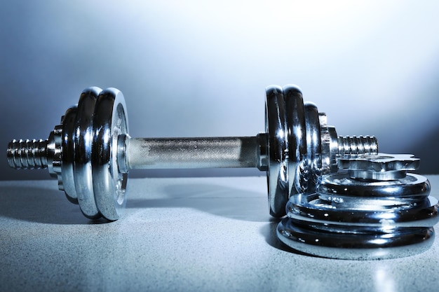 Dumbbells on gray background