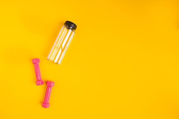 Dumbbells and water bottle set from above view