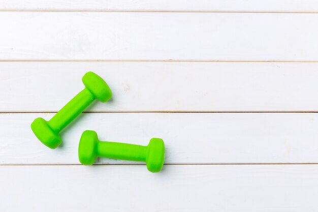 Dumbells on wooden floor