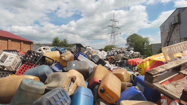 Dump industrial waste - Heaps of plastic debris . Against the blue sky, heaps of plastic debris lie