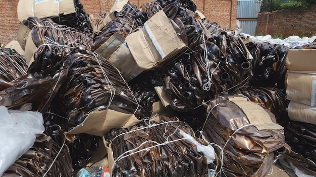 Dump industrial waste - stick of plastic bottles, close up