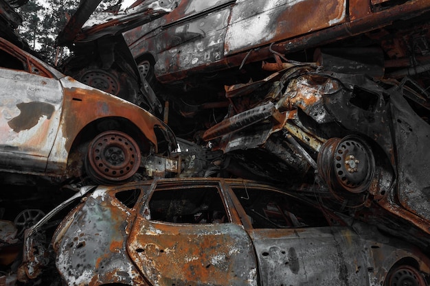 A dump of shot and burned cars as a result of the Russian invasion of Ukraine War in Ukraine