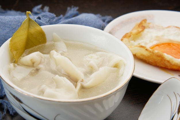 Dumpling Soup in a bowl on table,