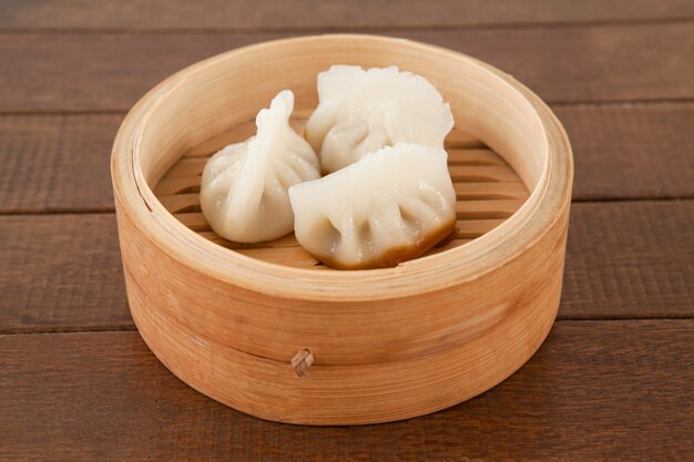 Dumplings in bamboo steamer