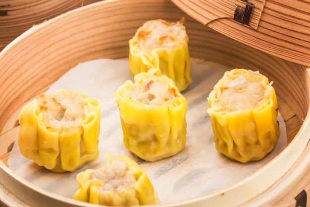 Dumplings in bamboo steamer