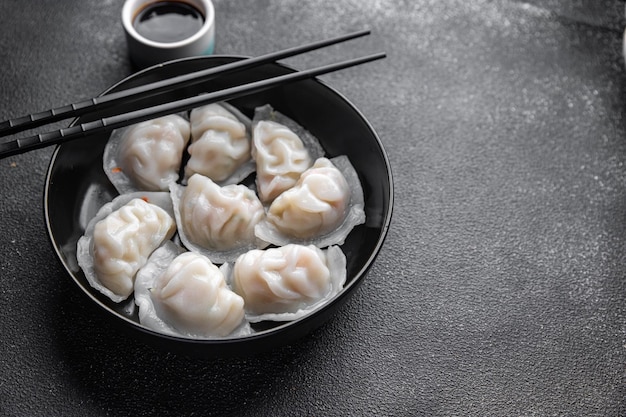 dumplings dim sum Chinees eten maaltijd snack op tafel kopie ruimte voedsel achtergrond rustiek bovenaanzicht