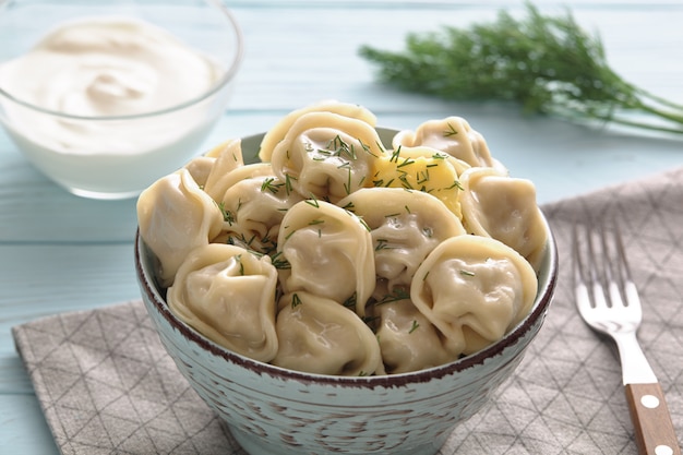 Dumplings dish on a light wooden table