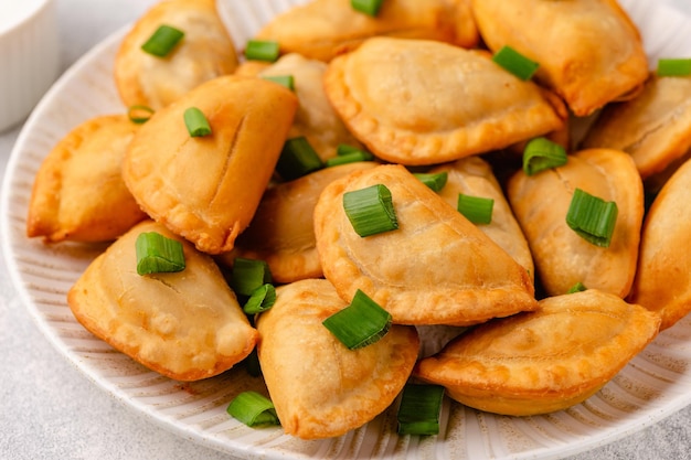 Dumplings filled with mashed potatoes Russian Ukrainian or Polish dish varenyky vareniki pierogi pyrohy