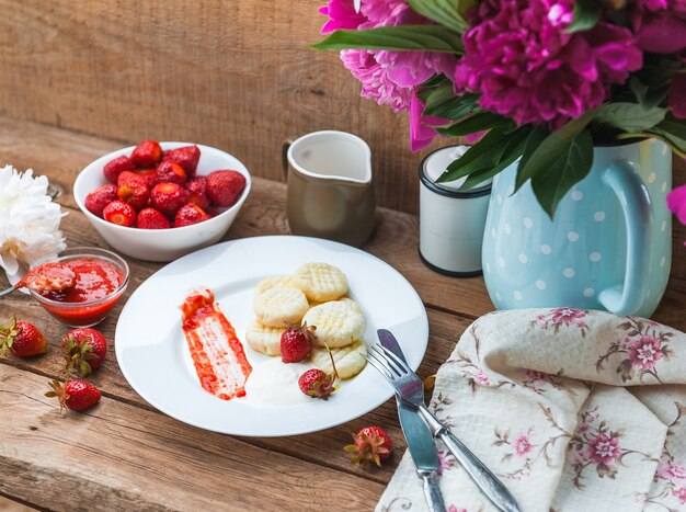 Dumplings from rice flour and cottage cheese with a pitted strawberry