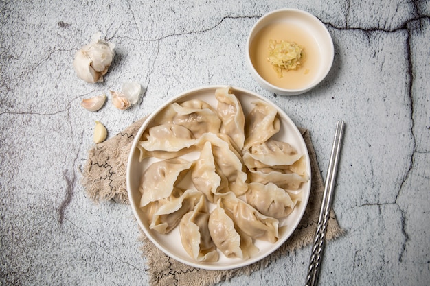 Photo dumplings stuffed with meat, ravioli, dumplings. dumplings with stuffing. dumpling ingredients,chinese cuisine