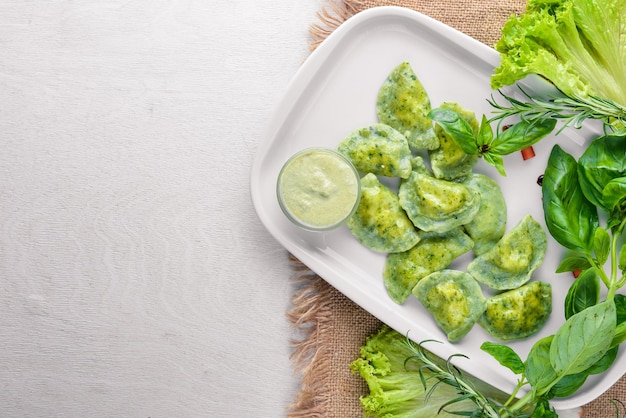 Dumplings with herbs Ukrainian style On a wooden background Top review Free space