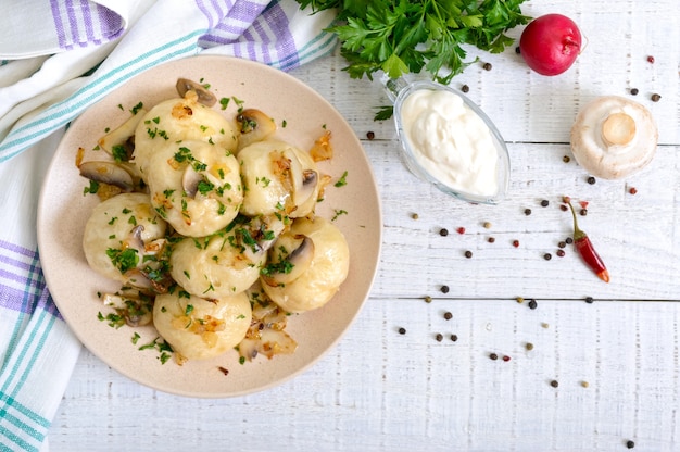 dumplings with meat and mushrooms in a bowl