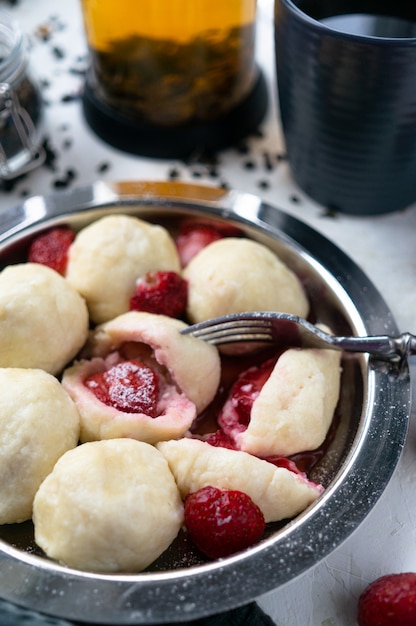 Photo dumplings with strawberries. close-up
