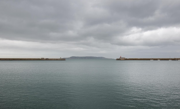 Dun Laoghaire port entry with West pier and East pier light houses