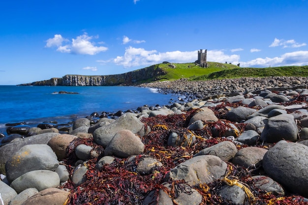 Dunstanburgh castle from embleton bay northumberland england