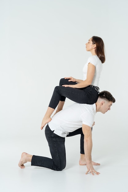 Duo Of Acrobats Showing Tricks, Isolated On White.