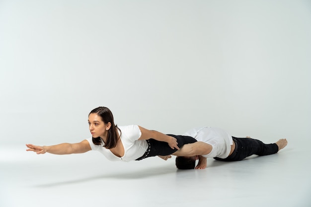 Duo Of Acrobats Showing Tricks, Isolated On White.