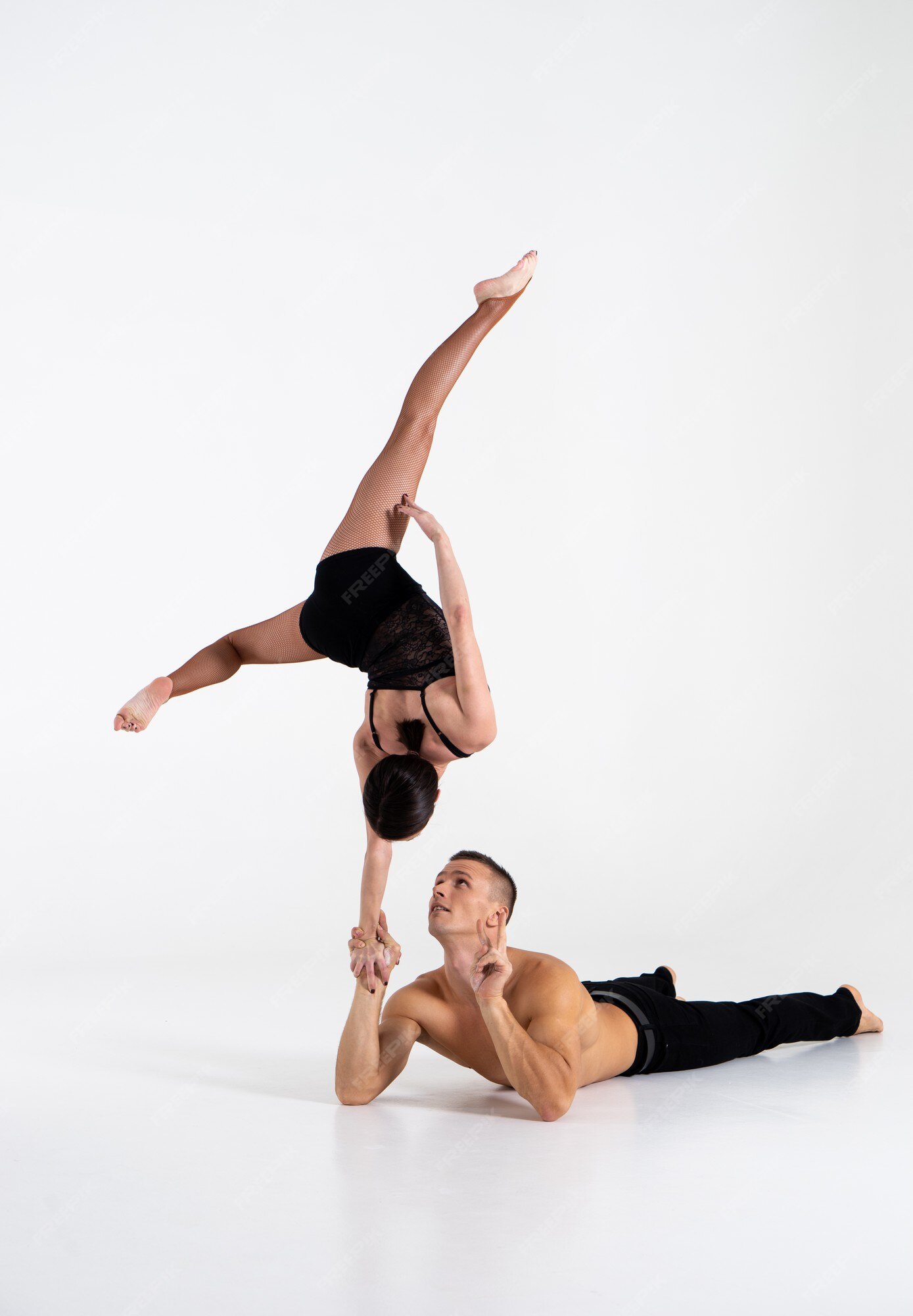 Premium Photo  Duo of male and female acrobats showing hand to hand trick,  isolated on white