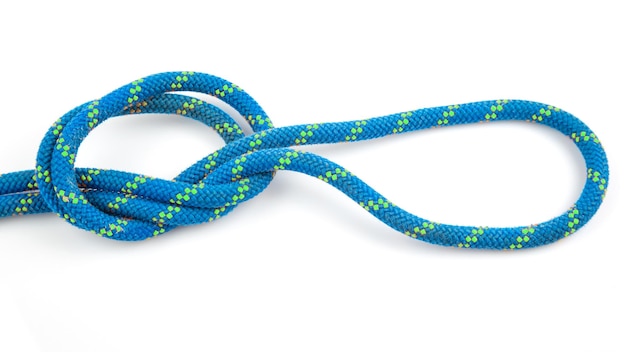 Photo durable colored rope for climbing equipment on a white background knot of braided cable item for tourism and travel