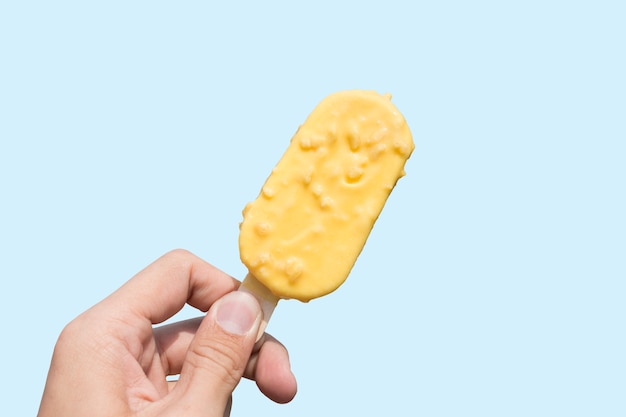 Durian ice cream with coconut coating isolate on blue