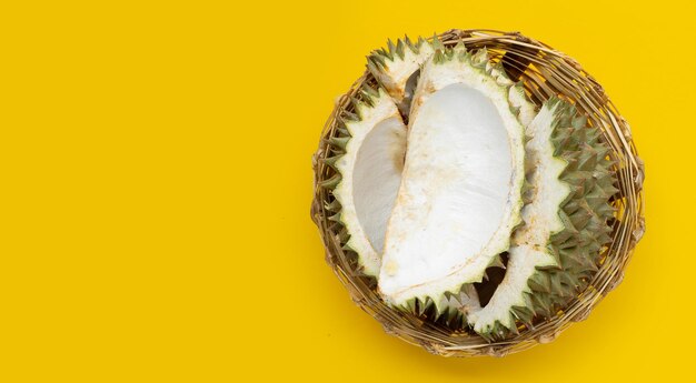 Durian peel in bamboo basket on white background