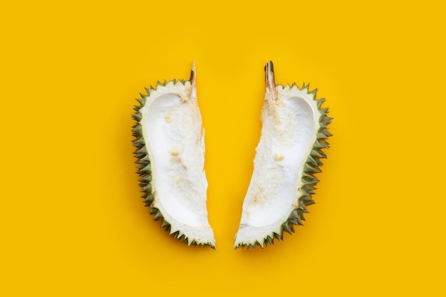 Durian peel on yellow background Top view