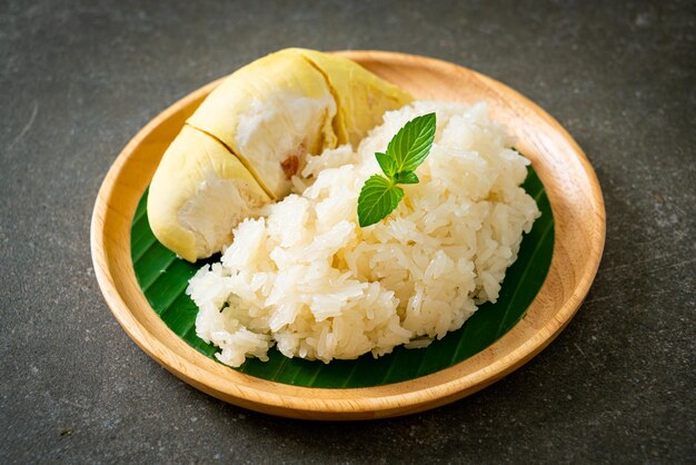 Durian with sticky rice -  sweet durian peel with yellow bean, Ripe durian rice cooked with coconut milk - Asian Thai dessert summer tropical fruit food