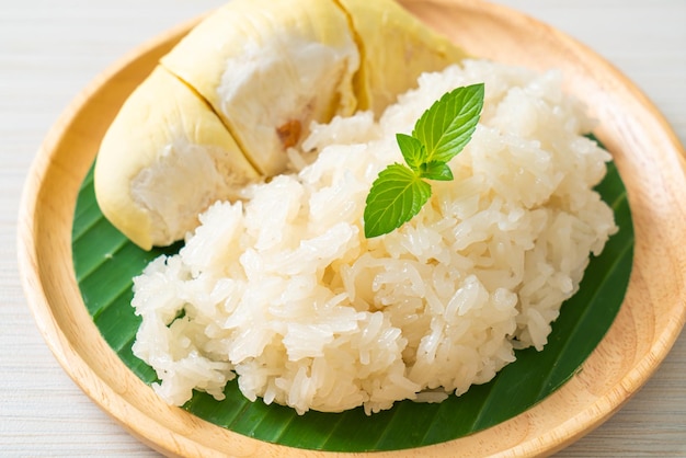 Durian with sticky rice -  sweet durian peel with yellow bean, Ripe durian rice cooked with coconut milk - Asian Thai dessert summer tropical fruit food