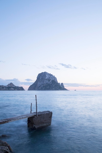 Dusk at Pier Hort Cove Beach Ibiza Spain