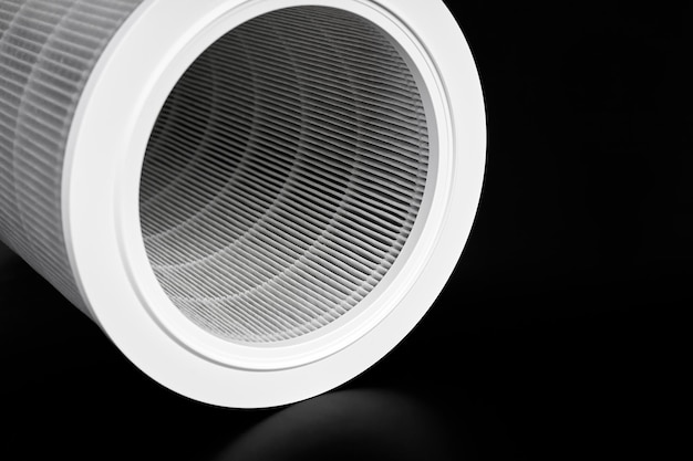 Dust contaminated home air purifier filter on dark background