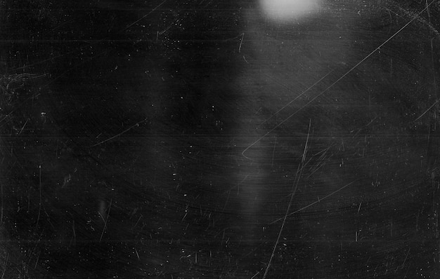 Dust scratches overlay. Distressed TV screen. Dark old dirty glass surface with smeared faded stains pattern. Black white weathered display texture.