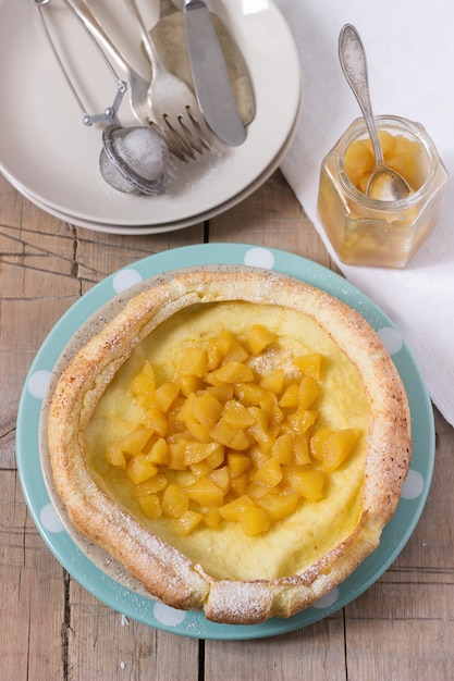 Dutch baby pancake with apple-cinnamon sauce.