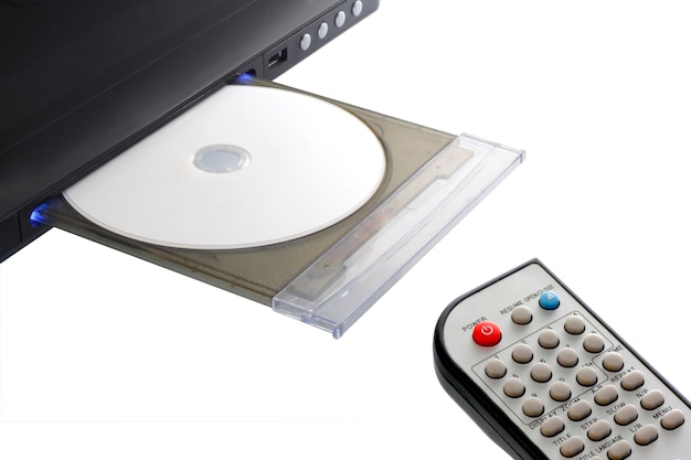 Dvd player and remote control with disk open tray isolated on white background