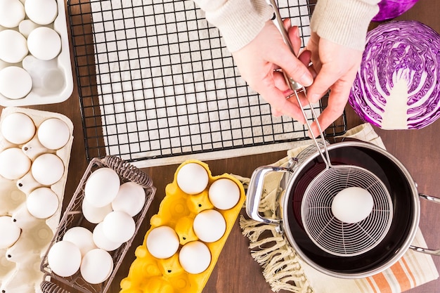 Dyeing Easter eggs with natural dye colors.