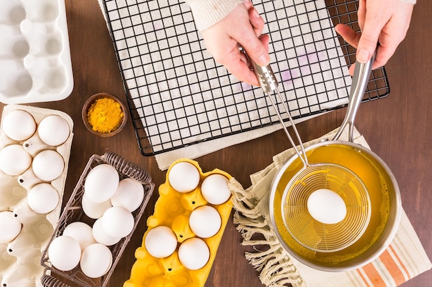 Dyeing Easter eggs with natural dye colors.