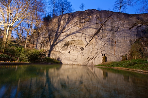 Dying lion monument in Lucern Switzerland at dusk