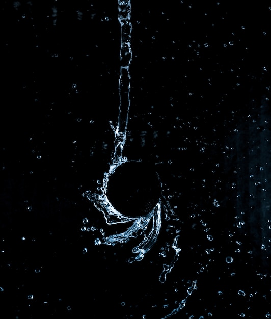 Dynamic liquid splash in the black background